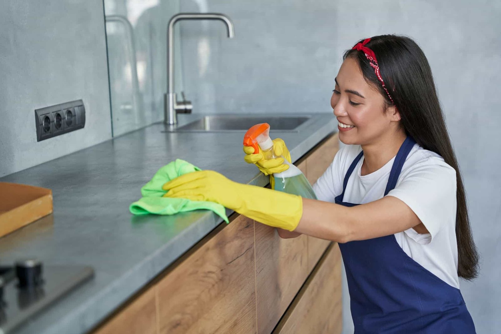 happy-young-woman-cleaning-lady-smiling-while-cleaning-the-kitchen.jpg